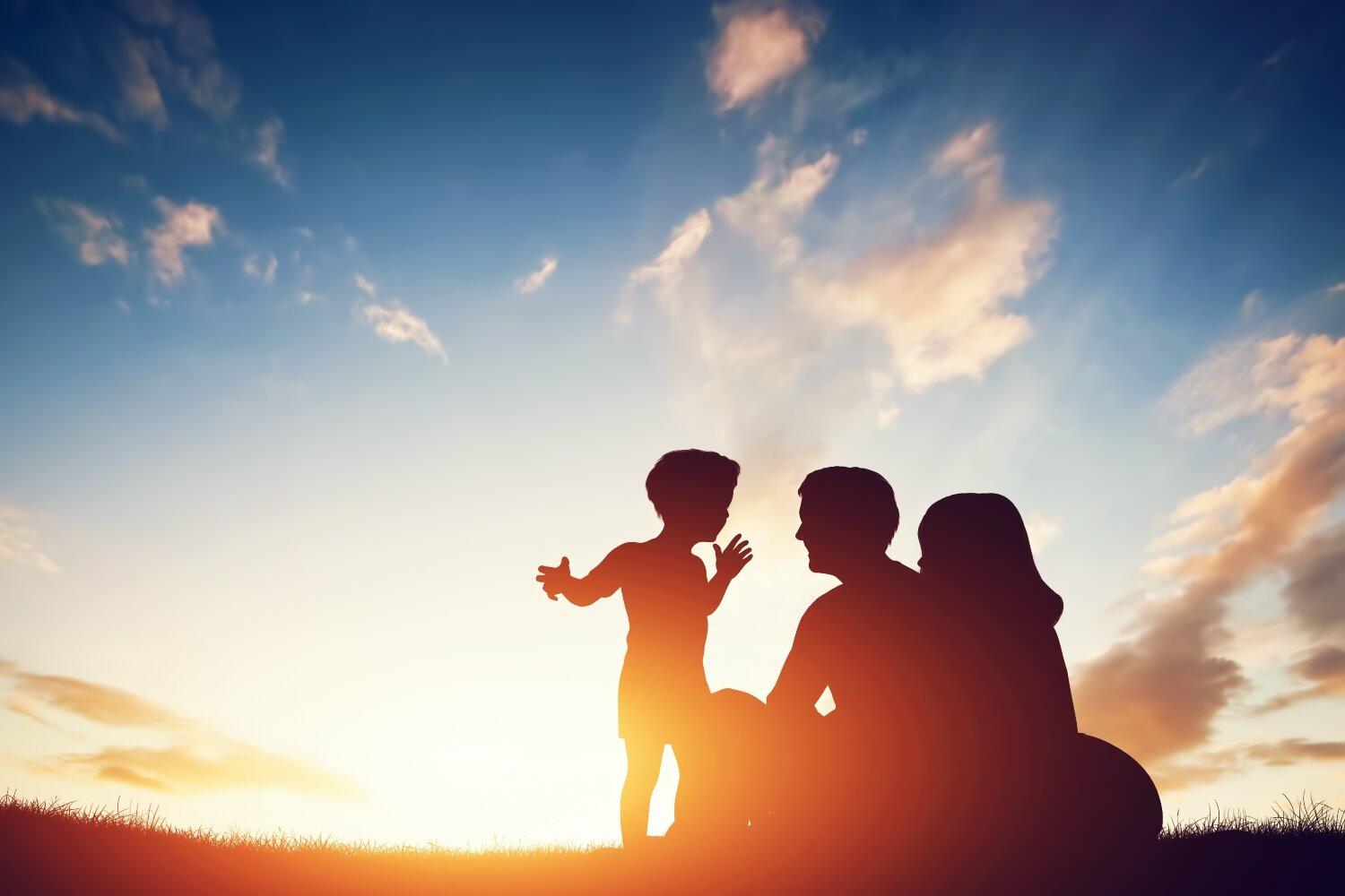 silhouette image of family sunrise