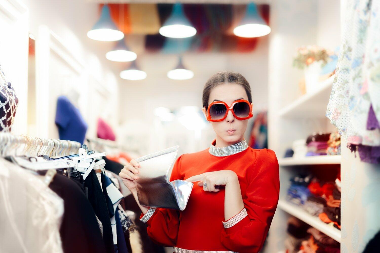 Woman Shopping with Oversized Sunglasses and Silver Clutch Bag