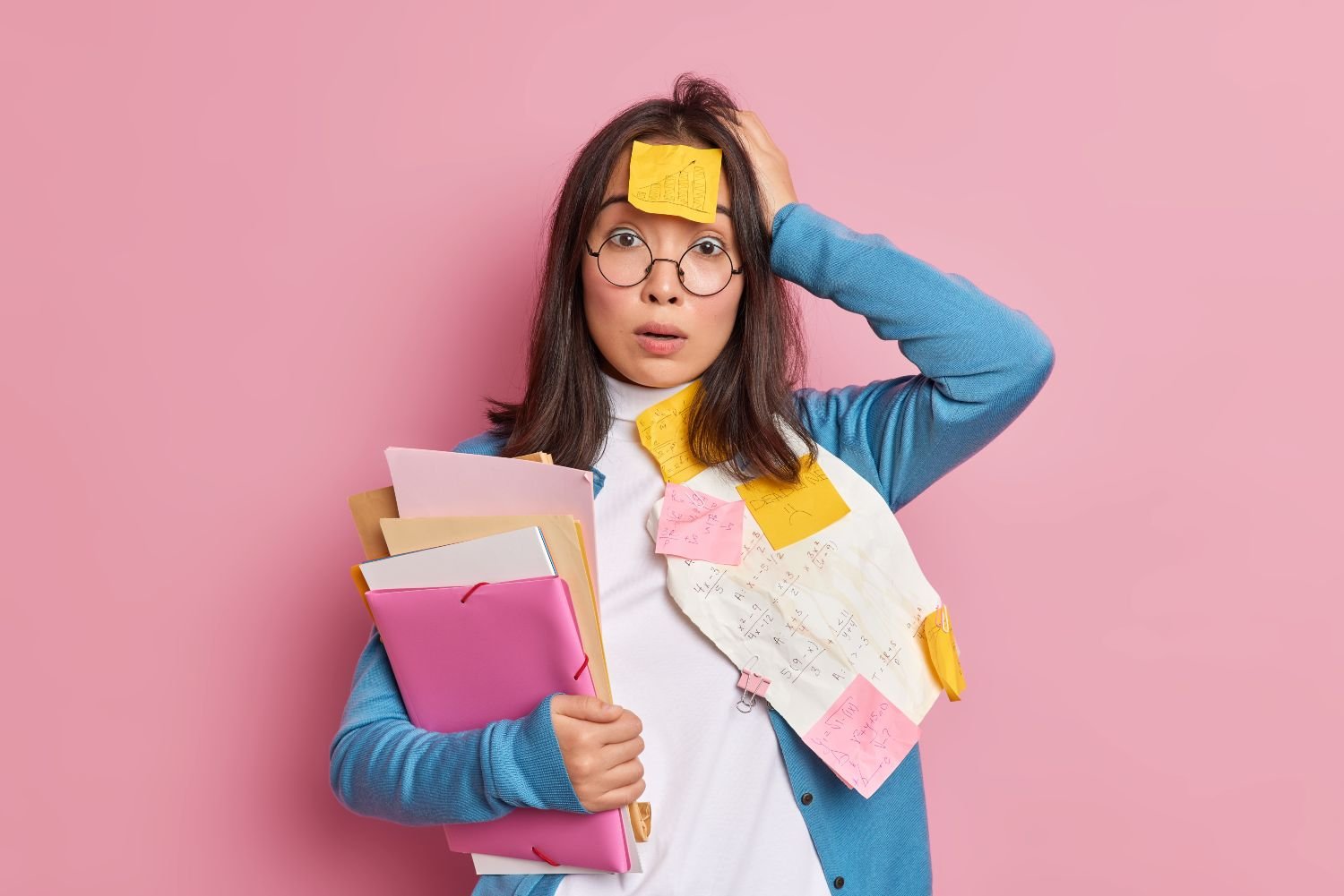 Puzzled shocked female office worker overloaded with paper work stunned to have deadline