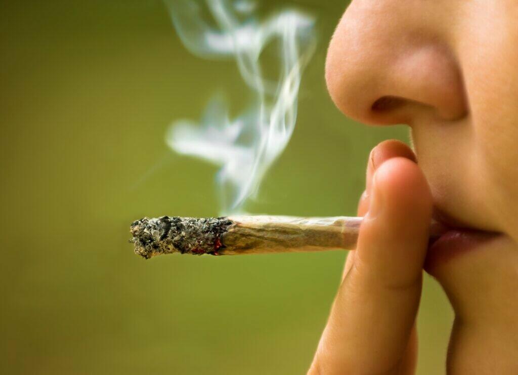 close up image of someone using a cannabis joint